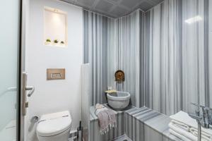 a bathroom with a toilet and a sink at BAB - by Menar Hotel in Istanbul +14 photos