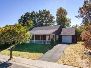 a home with a driveway and a house at Adorable Remodeled Quiet Near Town Fenced Yard Pet Friendly 4353 in Hood River