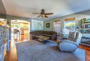 a living room with a couch and a ceiling fan at Adorable Remodeled Quiet Near Town Fenced Yard Pet Friendly 4353 in Hood River