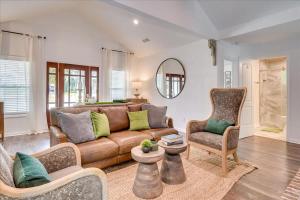 a living room with a couch and a chair at Southern luxury retreat Augusta Nat'l golf vibes in Augusta
