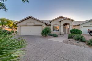 a house with a driveway and a garage at Ironwood Gilbert in Gilbert