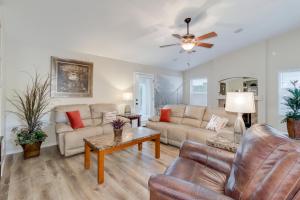 a living room with two couches and a ceiling fan at Ironwood Gilbert in Gilbert +31 photos