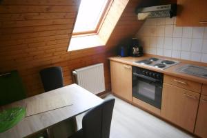 Η κουζίνα ή μικρή κουζίνα στο Wohnung In Ilfeld Mit Grill