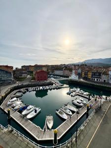 a group of boats are docked in a harbor at Apartamento La Magdalena Selnatur in Llanes