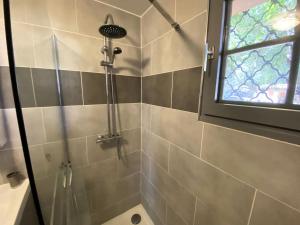 a shower with a glass door in a bathroom at Résidence La Grande Combe - 101 - Jolie villa familiale dans quartier calme et résidentiel MAE-4461 in Soulac-sur-Mer