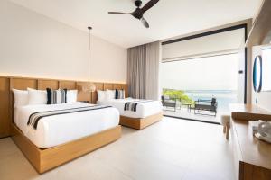Postel nebo postele na pokoji v ubytování Amaranto Bacalar Hotel Boutique
