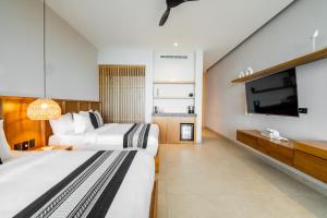 Postel nebo postele na pokoji v ubytování Amaranto Bacalar Hotel Boutique