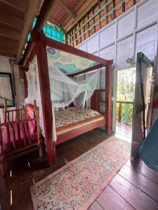 Postel nebo postele na pokoji v ubytování Gracias Madre Jungle and Ocean View Cabins