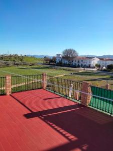 a metal fence on a patio with a park at Merino Casa Rural in Yunquera +8 photos