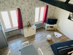 TV a/nebo společenská místnost v ubytování Studio Le Belle Vue