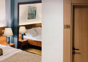 Postel nebo postele na pokoji v ubytování Hotel IL Sole