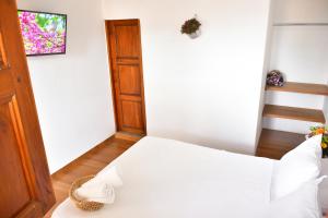 Postel nebo postele na pokoji v ubytování Hotel Quedate Aqui Barichara - El Original + 13 fotografií