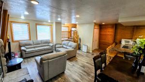a living room with two couches and a table at Coalition Lodge in Park City