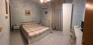 Postel nebo postele na pokoji v ubytování La Pergolina