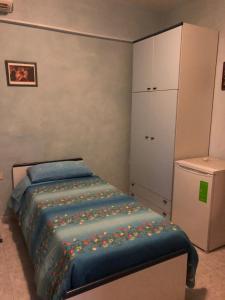 Postel nebo postele na pokoji v ubytování La Pergolina