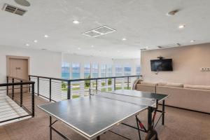 a living room with a table and a couch at Sunrise Resort Room #308 in Garden City