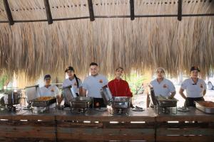 a group of people standing around a table with food at Hotel Villa Del Marques in Sopetran +38 photos