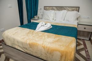 Postel nebo postele na pokoji v ubytování Royal Cairo Hotel