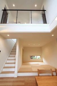 a large room with a staircase and a window at chrisloner1992 in Paniqui