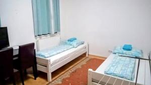 Postel nebo postele na pokoji v ubytování Vienna Rooms Nr 3