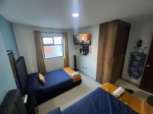 Postel nebo postele na pokoji v ubytování Apartamento Ángel Namaste