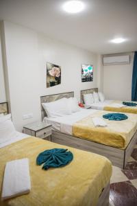Postel nebo postele na pokoji v ubytování Royal Cairo Hotel