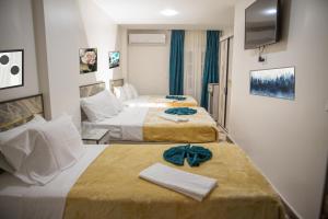 Postel nebo postele na pokoji v ubytování Royal Cairo Hotel