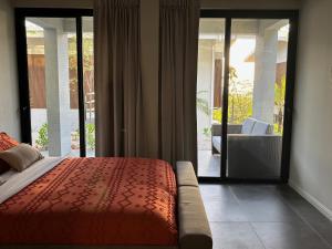 Postelja oz. postelje v sobi nastanitve Garden Suite at Solindo Stays