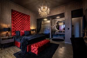 Voodi või voodid majutusasutuse Hotel Osvé Boutique Cali toas