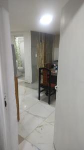 an empty living room with a table and a room with a floor at CIRCULO Depart in Comodoro Rivadavia