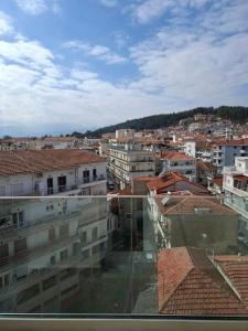 a view of a city with buildings and roofs at Kozani room with a view! in Kozani