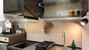 a kitchen with a sink and a counter top at SILVIO'S Apartment in Castellammare del Golfo
