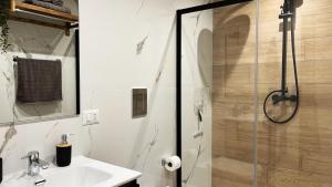 a bathroom with a sink and a shower at SILVIO'S Apartment in Castellammare del Golfo