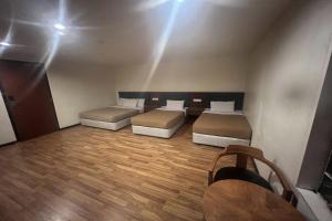 Postel nebo postele na pokoji v ubytování Iris House Hotel