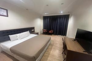 Postel nebo postele na pokoji v ubytování Iris House Hotel