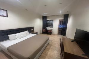 Postel nebo postele na pokoji v ubytování Iris House Hotel + 28 fotografií