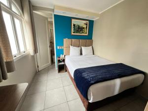 Cama ou camas em um quarto em Hotel Residencial Alfa
