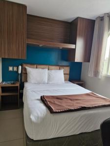 Cama ou camas em um quarto em Hotel Residencial Alfa