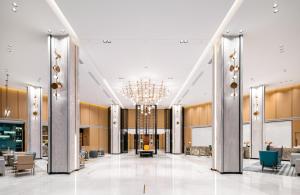 a rendering of a lobby with a chandelier at Sanya Golden Phoenix Seaview Hotel in Sanya +84 photos