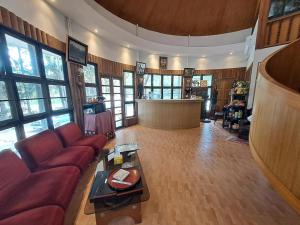 a living room with a couch and a table at Nomads Homestay Sriracha in Chon Buri