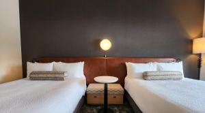 Postel nebo postele na pokoji v ubytování Rayland Hotel