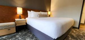 Postel nebo postele na pokoji v ubytování Rayland Hotel