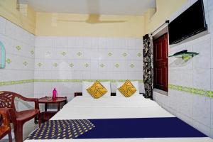 Postel nebo postele na pokoji v ubytování Hotel O Bikram Lodge + 37 fotografií