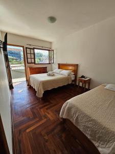 Ένα ή περισσότερα κρεβάτια σε δωμάτιο στο Pousada Portal da Serra +30 φωτογραφίες