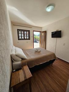 Μια τηλεόραση ή/και κέντρο ψυχαγωγίας στο Pousada Portal da Serra