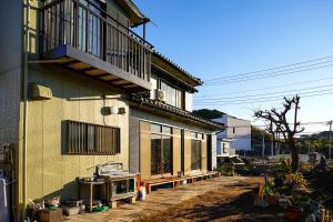 a house with a balcony on the side of it at nostalgia2 ノスタルジア2 in Yokosuka