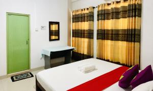 Letto o letti in una camera di Pawana Rest