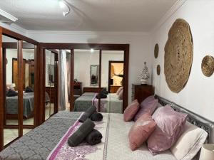 Una cama o camas en una habitación de Tropico Apartament