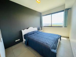 Uma cama ou camas num quarto em Unixx Pattaya High floor view