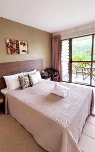 Postel nebo postele na pokoji v ubytování Vaea Hotel Samoa